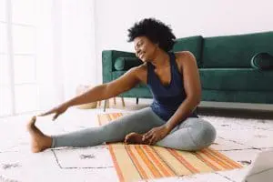 Cellulite Removal | Cellulite Treatment | Woman stretches on floor after having a cellulite treatment done by the professionals at Profile MD