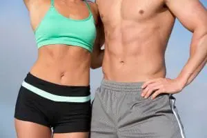 athletic woman and man with toned abdomen