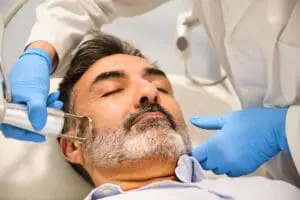 Man receiving laser skin resurfacing treatment.